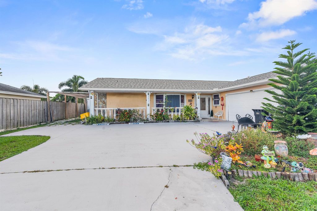Photo of 2044 SW Idaho Lane, Port Saint Lucie, FL 34953 (MLS # R11006211)