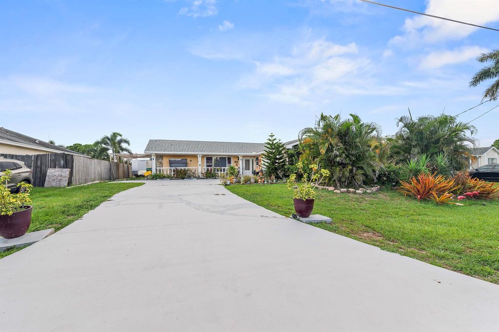 Photo of 2044 SW Idaho Lane, Port Saint Lucie, FL 34953 (MLS # R11006211)