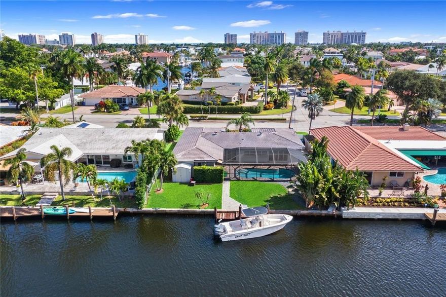 Move-in ready, this recently updated pool home located in highly sought after community is available for a quick closing! 75 ft of waterfront, perfect for dockage up to approx. 40 ft boat (depending on tides, 2 fixed bridges with approx. 10ft clearance), kayaks and/or jet skis! Expansive wide open canal views from kitchen & living room.  Filled with light, sliding glass doors open to pool area. Crisp white kitchen with new SS appliances and granite counters is open to dining/living areas complete with new porcelain floors throughout. Private primary suite has direct pool access, custom built-in closets, spa-tyle bath, dual vanities & access to outdoor shower. Two additional bedrooms share a renovated bath. New A/C. Close proximity to beaches, dining, shopping, top schools & major highways.