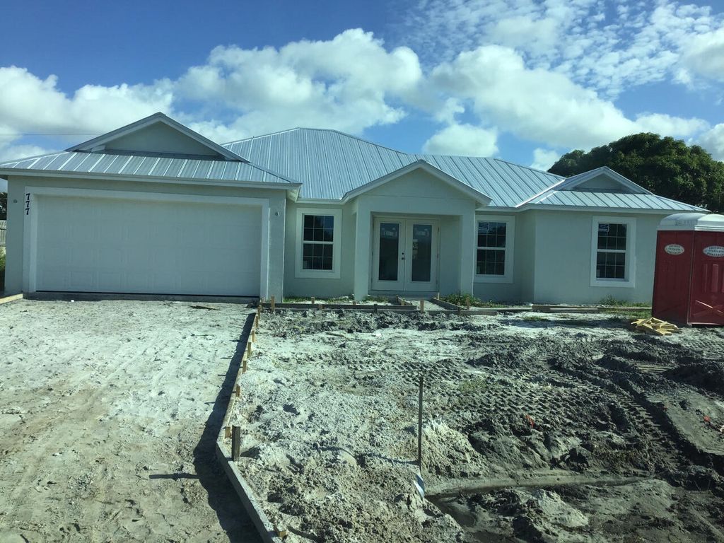 Photo of 777 SE Essex Drive, Port St Lucie, FL 34953 (MLS # R10844608)