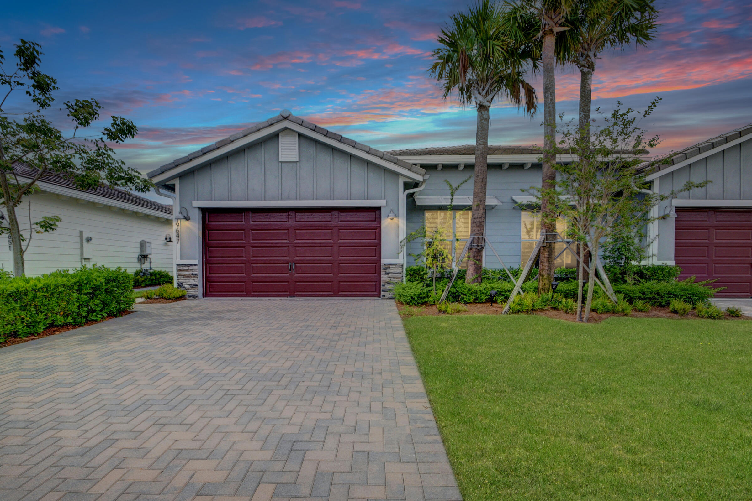 Welcome to Arden Agrihood! Experience the serenity, comfort, and elegance of this beautiful 2021 villa. It features an all-white kitchen with quartz countertops, custom blinds, wood-look tile flooring, and a covered patio overlooking lush greenery to the North. Enjoy the luxurious primary suite with two walk-in closets and an en-suite bathroom that includes a step-in shower, separate WC, and dual sink vanity. The split bedroom plan provides privacy, with two additional bedrooms plus a den. The washer and dryer are conveniently located in a separate hallway closet, making laundry easy. Arden's unique community offers parks, playfields, trails, a farm, a pool, a fitness center, and a lovely lake for fishing. Plus, it is zoned for some of the best schools in Palm Beach. Ready for move-in!
