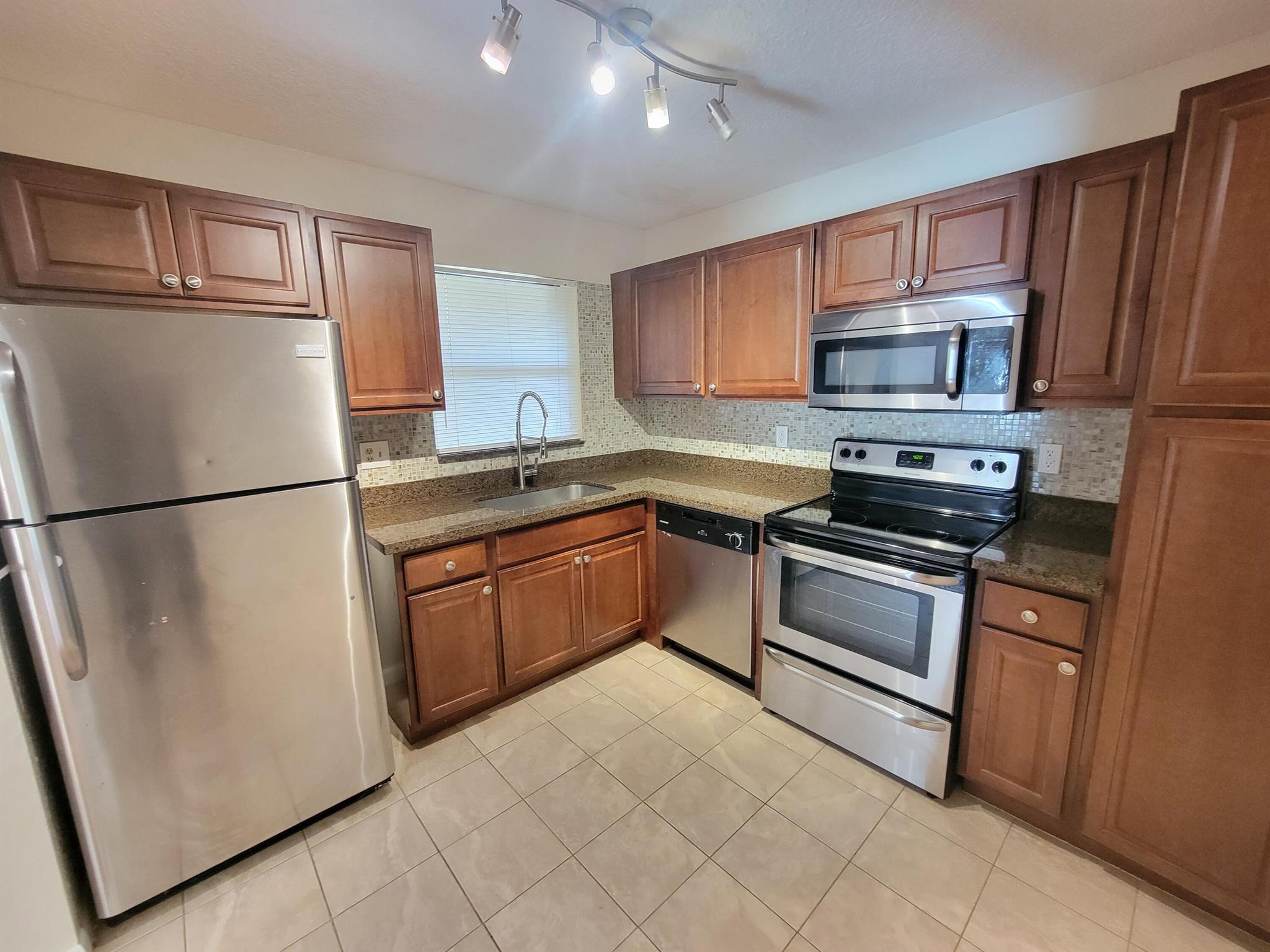 Gorgeous updated 2/2 split floor plan ,large screened patio, spacious walk- in closet, washer & dryer Remodeled kitchen,granite countertop and stainless steel appliances. Remodeled Bathroom as well. Water and basic cable are INCLUDED in the HOA. Accordian shutters in all windows and patio, peace of mind. Enjoy all TOWNSHIP amenities, including Fitness Center, Clubhouse activities,Walking paths, Heated Pools, Theater & much more. Pet allowed, just one up to 25lbs. Association DOESN'T require minimum down payment. Ready to MOVE-IN. Can rent right away