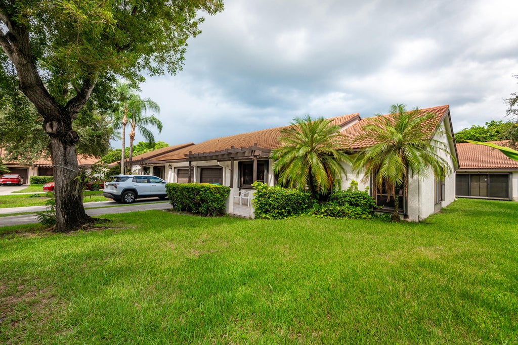 Photo of 7143 WISTERIA Way, Tamarac, FL 33321 (MLS # B26072673)