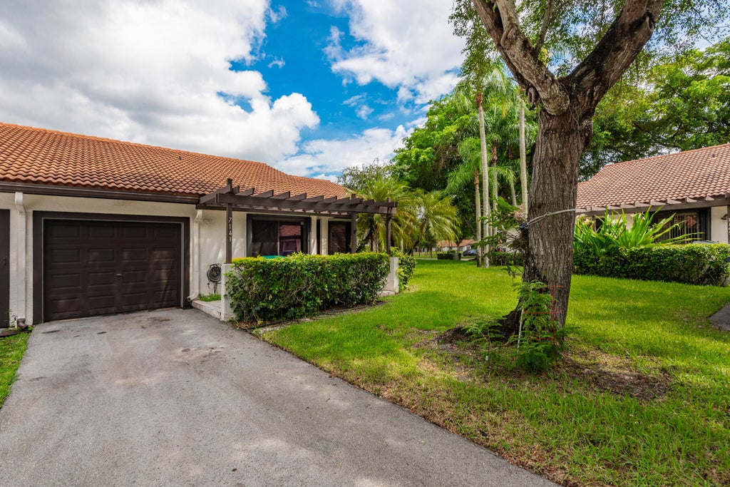 Photo of 7143 WISTERIA Way, Tamarac, FL 33321 (MLS # B26072673)