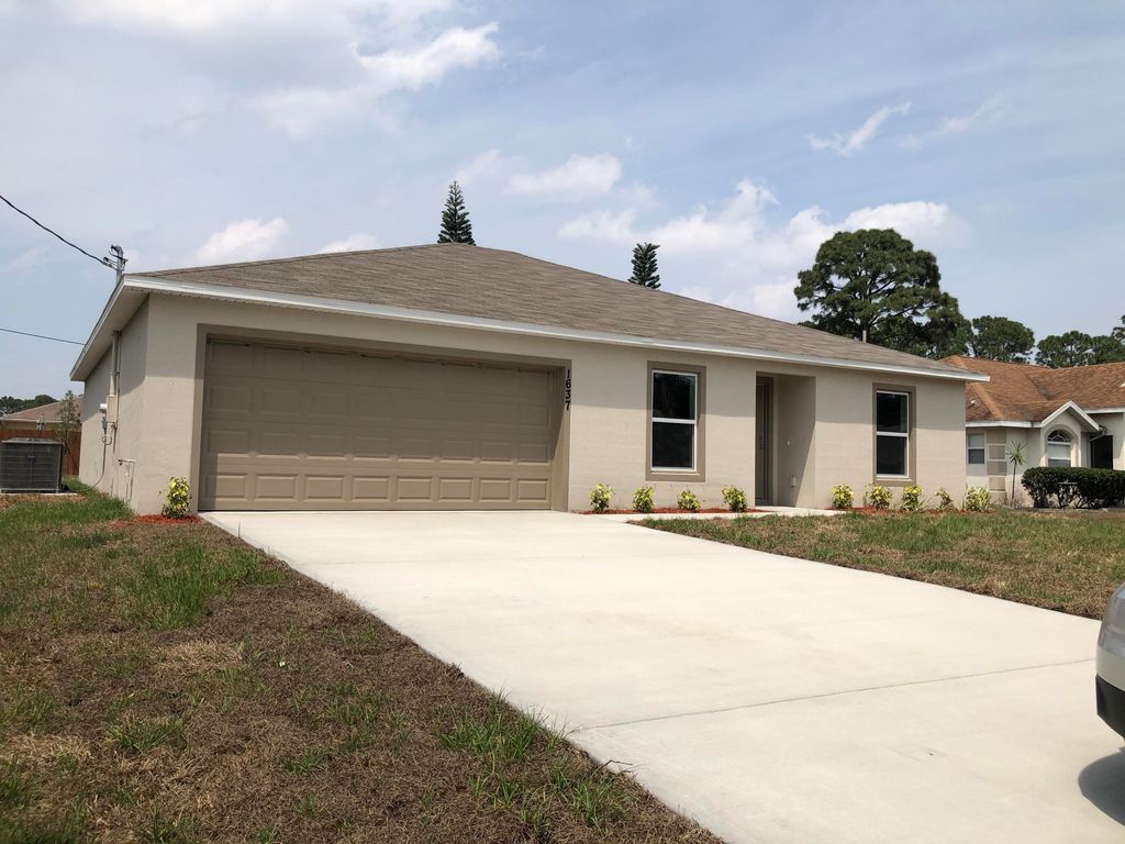 Photo of 1637 SW Lofgren Avenue, Port St Lucie, FL 34953 (MLS # R10866943)