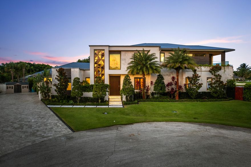 Lake Eden Masterpiece - Luxury Redefined
Exclusive lakefront sanctuary in a coveted non-HOA community offers privacy, elegance, & breathtaking east-facing lake views with refreshing breezes year-round. Designed by Randall Stofft, this custom masterpiece sits on an oversized cul-de-sac lot, wrapped in gorgeous keystone with designer finishes throughout.
Soaring 12-foot sliding glass doors allow for seamless indoor outdoor living. The Control 4 system, cozy theater, cooled wine room, sauna & 12-person hot tub elevate luxury living. An expansive covered outdoor retreat & new dock make entertaining effortless.
Ideally located in Palm Beach Co. just 1.5 miles from the beach & downtown Delray, with easy access to top private schools & airports.
*Detailed List of Property Features Attached