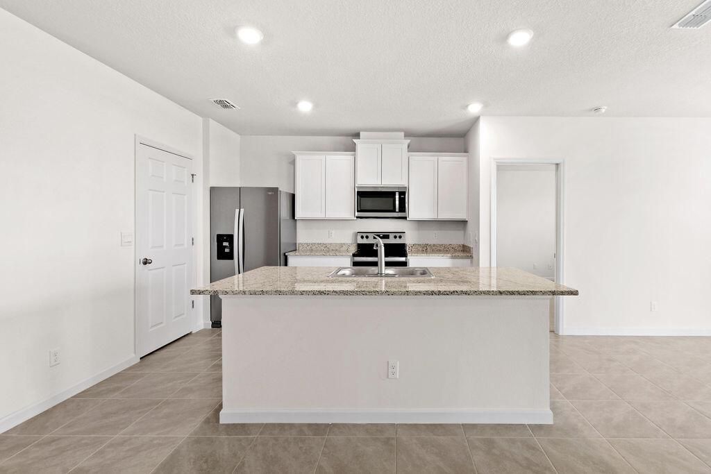 Photo of 9748 SW Triton Way, Port Saint Lucie, FL 34987 (MLS # R10985173)