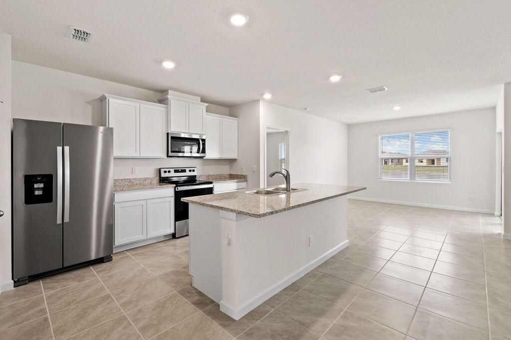 Photo of 9748 SW Triton Way, Port Saint Lucie, FL 34987 (MLS # R10985173)