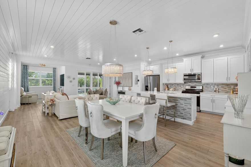 Make an offer. Welcome to your designer-inspired retreat in the heart of Telaro at Tradition. Every detail of this stunning property has been thoughtfully curated to blend comfort, sophistication, and modern coastal charm. From the moment you arrive, the upgraded garage door sets the tone for the quality craftsmanship found throughout. Inside, you'll be greeted by beautiful plantation shutters and a custom wall-mounted fireplace that instantly make the space feel warm and inviting. The main living areas feature tile floors, shiplap-accented ceilings that add character and texture, while additional shiplap walls in the living room and guest bath provide a timeless designer touch. The open-concept layout flows seamlessly through the kitchen, dining, and great room—airy, elegant atmosphere. Making this great for both entertaining and relaxing. Step outside to your extended patio, complete with a seamless screen enclosure, making this perfect for enjoying tranquil mornings or breezy Florida evenings. Every window and door is protected with full impact glass, offering peace of mind and energy efficiency year-round.
Located in the highly desirable Telaro at Tradition, this home offers not only impeccable design but also access to world-class amenities and a vibrant 55+ active lifestyle community. Not yet hit 20% capacity so all ages are welcome. Experience refined living where luxury meets comfort, and every day feels like a getaway. Drive your golf cart to your local favorite stores and restaurants and live the lifestyle you deserve. Very active community with multiple pools, incredible gym facilities, fine dining, restaurants, bocce ball, tennis, pickleball, security, walking trails, and so much more!