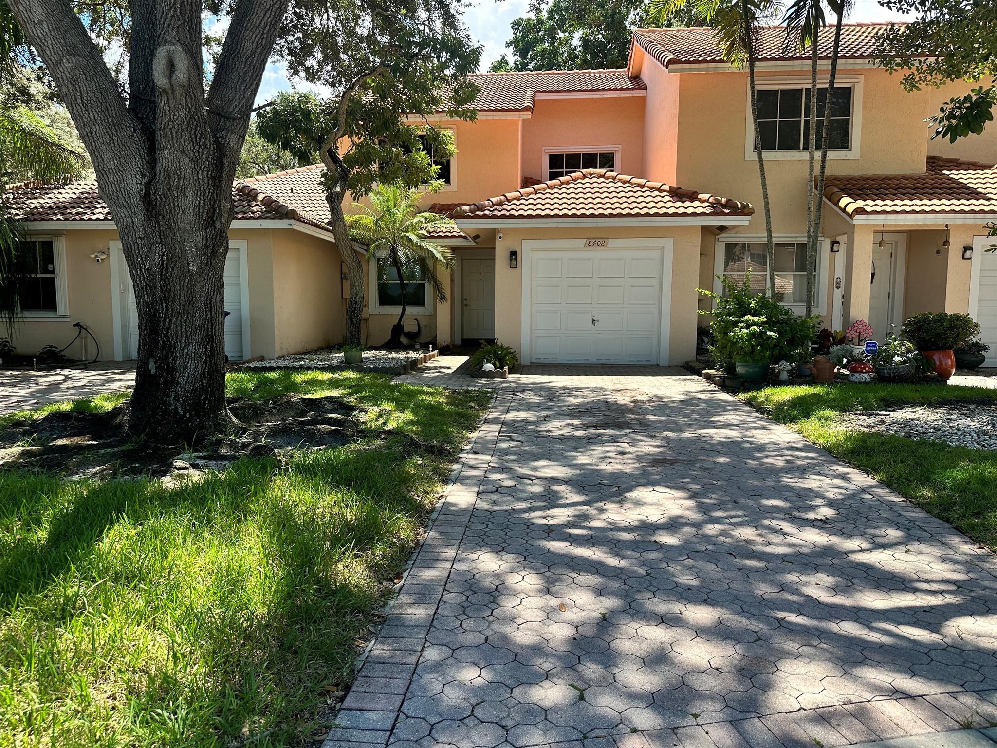 Step into comfort and style at this thoughtfully updated 3-bed 2.5 bath townhome nestled in Sunrise’s coveted Spring Tree community. Boasting 1,448 sq ft of living space, this two-story gem is bathed in natural light and features modern finishes—granite countertops, stainless appliances, elegant tile downstairs, and warm wood upstairs. Park with ease in your 1-car garage and host in a space where your driveway welcomes extra guests. HOA provides a community pool and well-maintained grounds. Conveniently located minutes from Sawgrass Mills and major highways, this townhome perfectly balances lifestyle and location. This Sunrise townhome invites you to embrace comfort and opportunity. Contact us today to explore this move-in-ready haven before it’s gone.