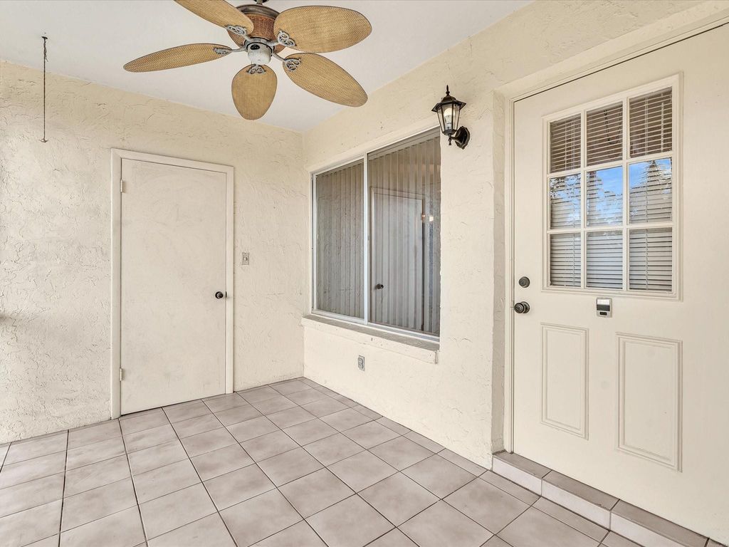 Photo of 305 Knotty Pine Circle #A2, Greenacres, FL 33463 (MLS # F10554957)