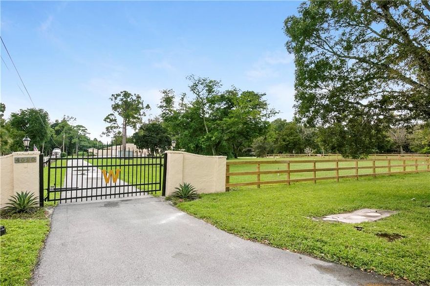 RARELY AVAILABLE EQUESTRIAN PROPERTY ON 2.46 ACRES VERY PRIVATE WITH A 7 STALL BARN, TACK ROOM AND WORK SHOP. THIS COURTYARD POOL HOME HAS NEW IMPACT GLASS, FRESHLY PAINTED INSIDE AND OUT, RECESSED LIGHTING, 2 MASTER BEDROOMS,WOOD BURNING FIREPLACES, SALT WATER POOL, WELL WATER FILTRATION SYSTEM IN PLACE. ONE MASTER BEDROOM HAS A PRIVATE DECK AREA WITH ROOM FOR A HOT TUB AND ACCESS TO THE POOL. THE BOATHOUSE IS SCREENED WITH A DOCK AND STOCKED WITH FISH IN THE POND. FENCING FOR THE PADDOCKS ARE NEW. THIS PROPERTY HAS OPPORTUNITY FOR INCOME PRODUCING, AGRICULTURAL OR NURSERY. IT IS CENTERALLY LOCATED BY TRADEWINDS PARK FOR TRAIL RIDING AND MINUTES AWAY FROM THE PROMENADE AND SHOPPING.