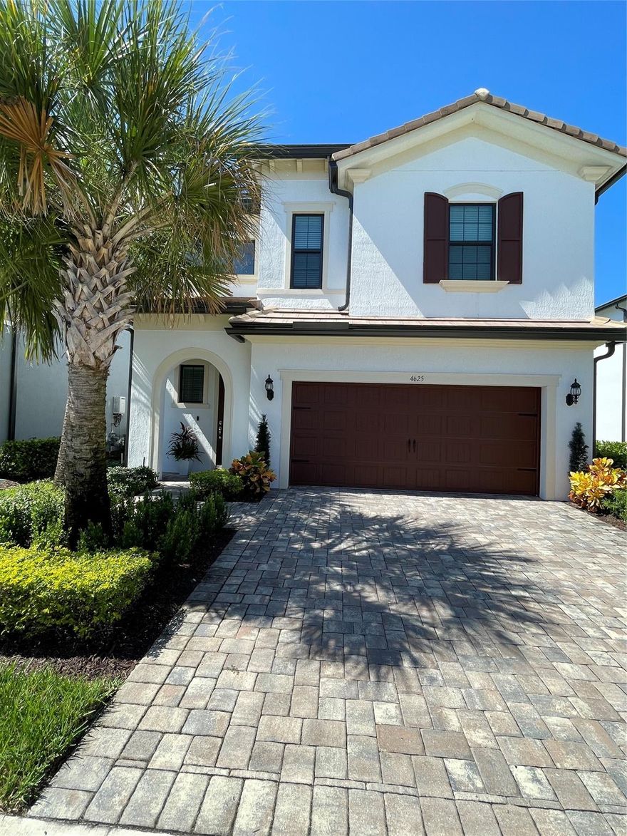 This beautifully decorated home located in one of the areas newest gated communities in Oakland Park's Oak Tree sub-division is a must see.  Located on a larger, private lot with privacy hedges, an oversized and extended covered screened-in lanai that includes a salt water hot tub.  Enter this home's open and mirrored two-story foyer that leads into a spacious living/dining/gourmet kitchen with quartz countertops.  This home also provides an upstairs loft area, along with 3 bedrooms with walk-in closets, 2 baths; including an oversized soaking tub in the master,  and a separate laundry room.  Enjoy the spectacular community amenity center that includes a resort-style pool, a clubhouse with a fully equipped fitness center, pickleball courts, conversation area firepit, and much more.