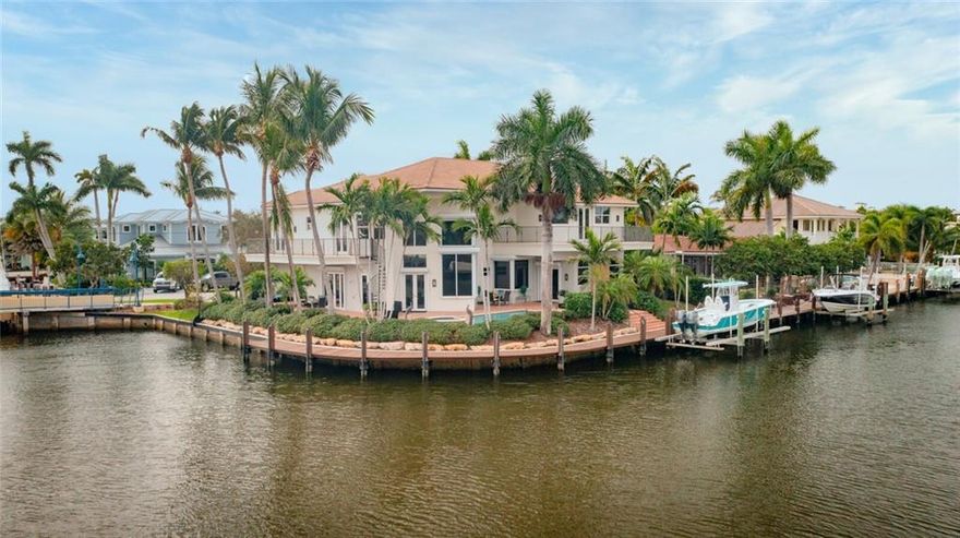 Spectacular two story residence with 5 bedrooms, office, 4 full bathrooms and 2 half baths sited on a large point lot with 183' of prime deep waterfront.  The property is on one of the widest waterways in Lighthouse Point with a width of 93'.   Many custom touches throughout include marble, and porcelain floors, a grand wrought iron staircase, wet bar, impact windows/doors,  heated saltwater pool with spill over spa, cabana bath, all house water purification, 130’ dock with water/50 amp electric and a 20k lbs boat lift.  The custom kitchen consists of high end finishes, quartz countertops, granite island, stainless steel appliances, pantry closet and a butler’s pantry.  The property is in close proximity and equidistant to both the Hillsboro Inlet and Boca Inlet! Seller's Disclosure