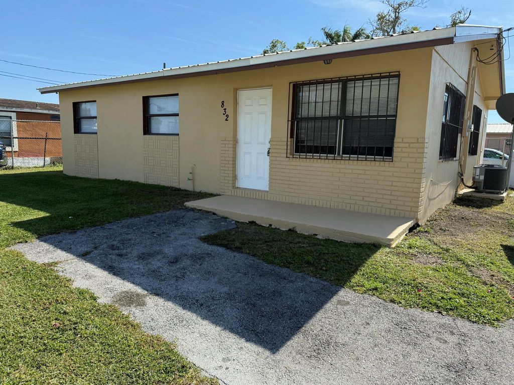 Photo of 832 SW Avenue B, Belle Glade, FL 33430 (MLS # R11058425)