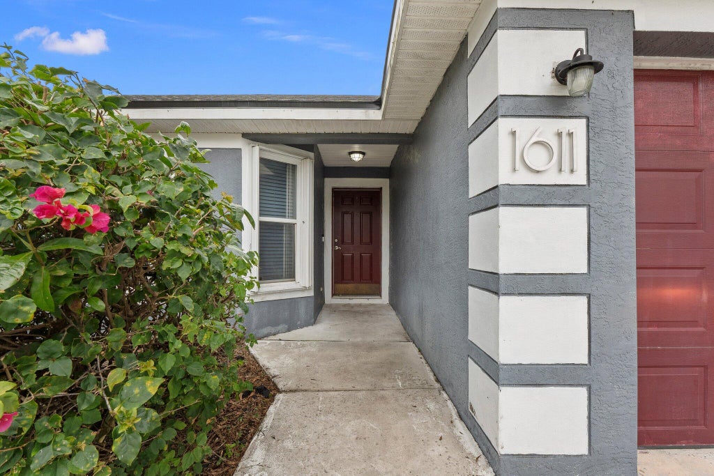 Photo of 1611 SW Glacador Avenue, Port Saint Lucie, FL 34953 (MLS # R11053143)