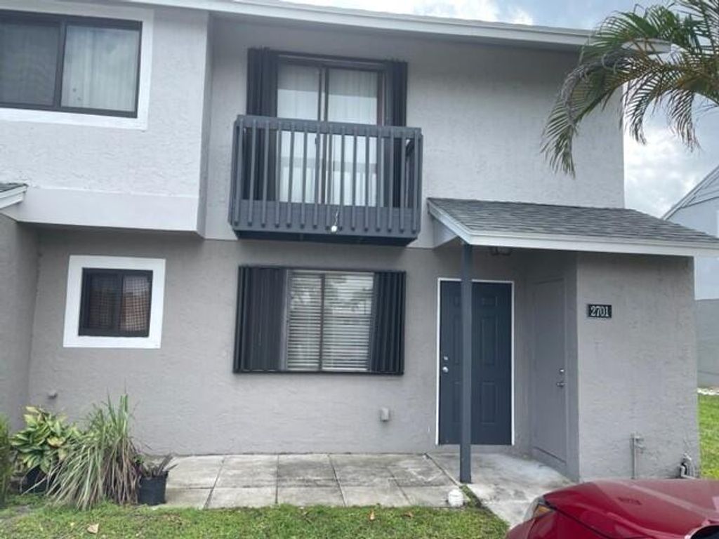 Photo of 2701 Canalside Drive, Greenacres, FL 33463 (MLS # R10967978)