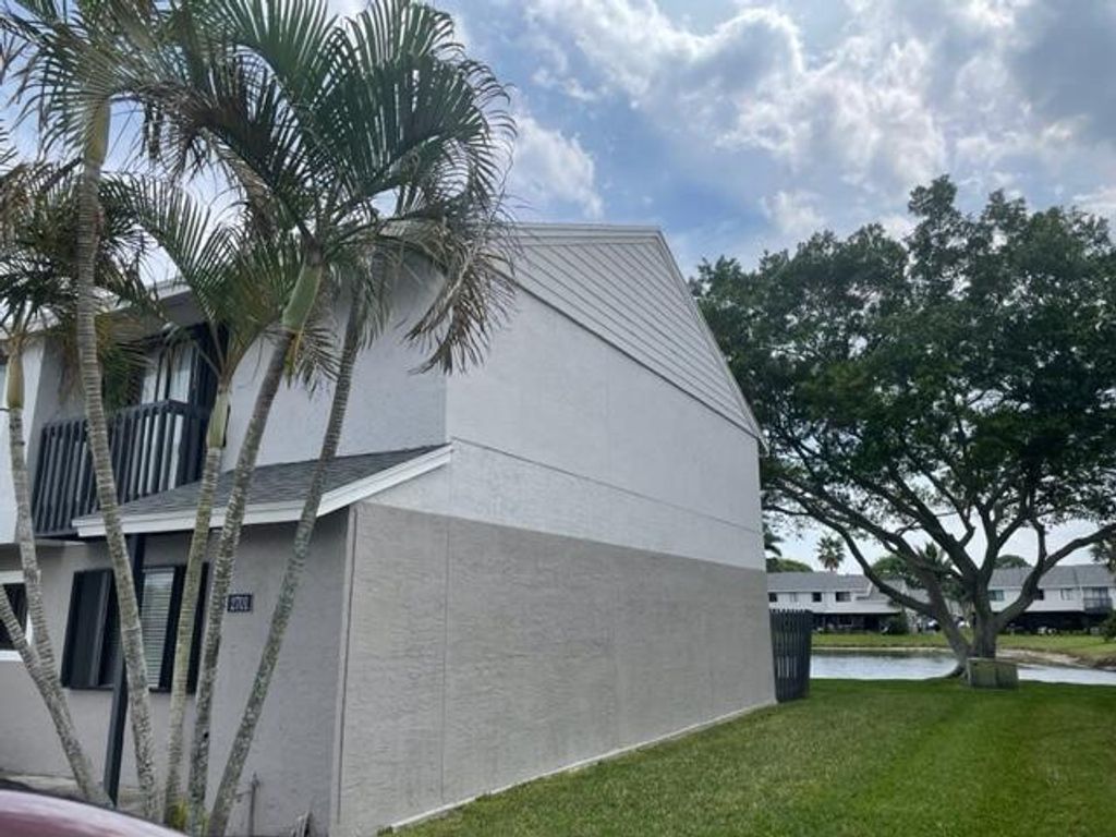 Photo of 2701 Canalside Drive, Greenacres, FL 33463 (MLS # R10967978)