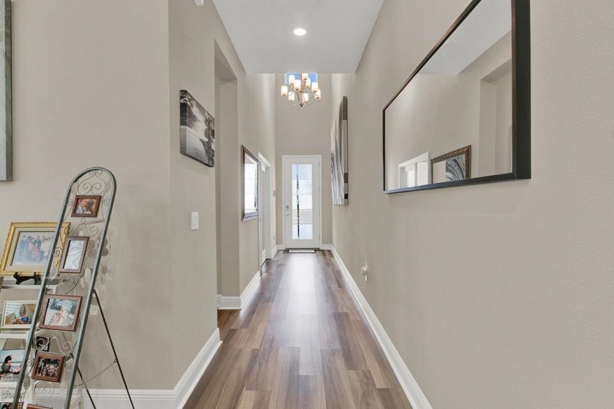 Seller willing to cooperate with credit  towards closing costs where the buyer can use towards interest rate buy down or closing costs expense. Call us for details.  Welcome to your extraordinary new residence, a modern masterpiece nestled in the heart of luxury living. This impeccable home, constructed in 2021, invites you into a realm of opulence and convenience, boasting an expansive layout spanning over 4,000 square feet. Upon entering, be greeted by soaring high ceilings that amplify the sense of space and elegance. Discover a sanctuary offering 5 bedrooms with a den and 4.5 baths, including a sumptuous master suite complete with a large sitting room and private balcony overlooking the meticulously landscaped lighted backyard oasis. Entertain with ease in the gourmet kitchen, equipped with state-of-the-art appliances and adorned with sleek countertops. The culinary experience is enhanced by the pre-wired sound system, setting the perfect ambiance for every occasion. Indulge in the added convenience of a ground-floor bedroom with a full bathroom, perfect for accommodating in-laws or guests with ease.
Step outside to your private paradise, where paved pathways wind through lush artificial grass, leading to the heated pool and soothing hot tub. Enjoy year-round comfort with the UV system ensuring crystal-clear waters, while motorized screens provide privacy and protection on both the patio and balcony. Plus, the addition of solar panels ensures energy efficiency, reducing your carbon footprint while saving on utility costs. Relish in the luxury of smart home technology, with app-controlled features including the pool, AC, appliances, and lighting. Retreat indoors to find comfort in every detail, from the motorized blinds and ceiling fans to the extra storage space in the tandem 2-car garage. Convenience meets excellence with nearby schools, including a high school, middle school, and elementary school all less than a mile away. Plus, with no neighbors in the front and a charming park next door, this home boasts an extended lot making it the largest in the neighborhood, ensuring privacy and tranquility. Located just 1.5 miles from the magic of Disney World, this home offers the rare opportunity to witness the enchanting fireworks of Magic Kingdom each night, creating a truly unforgettable experience for you and your loved ones. Welcome to your dream home, where luxury, comfort, and technology converge to create an unparalleled living experience.