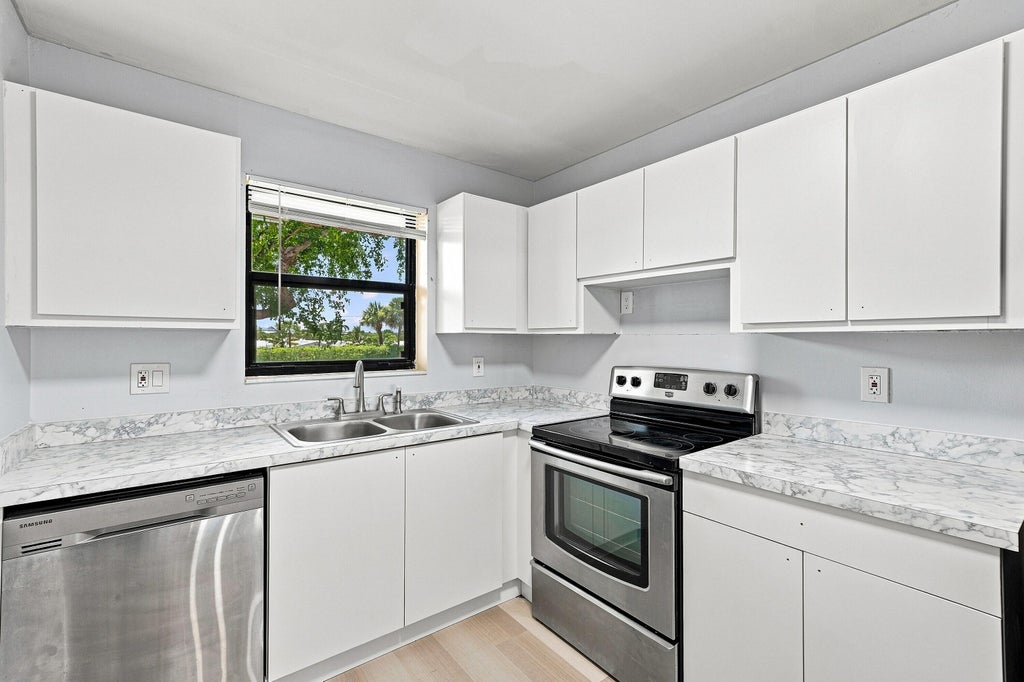 Photo of 2181 W Woolbright Road #N201, Boynton Beach, FL 33426 (MLS # B26066040)