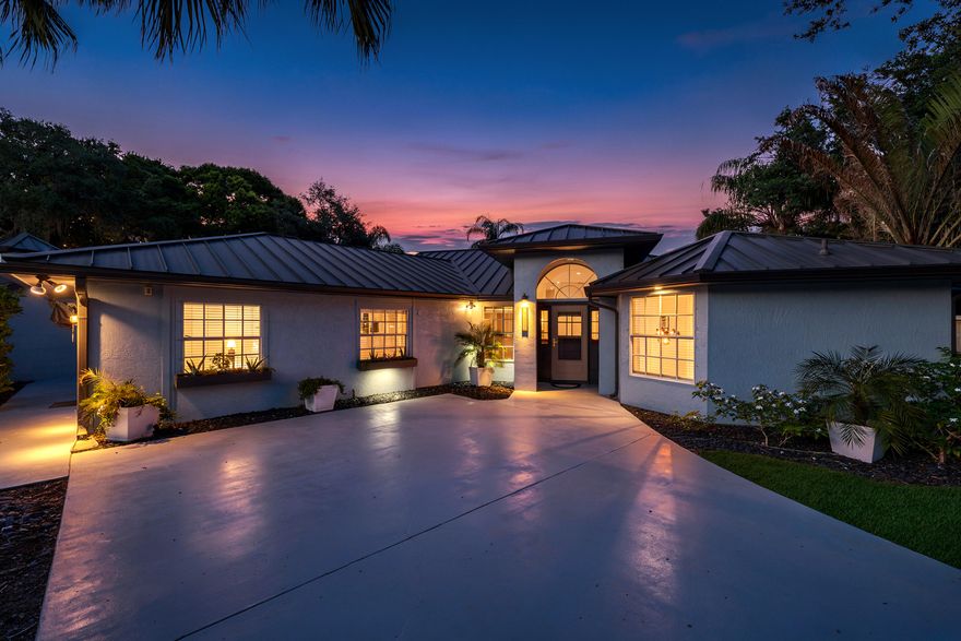 Welcome to this beautifully updated 4-bedroom, 3-bathroom home situated on an oversized half-acre corner lot offering space, flexibility, and income potential all in one. This property features a thoughtfully designed layout including a dedicated nursery room, making it perfect for growing families. The dining area is enhanced with a stylish barn door, allowing the space to be easily transformed into a formal dining room, private home office, or even a gym. The home has been tastefully upgraded with a brand-new metal roof, a modernized kitchen, and fully updated bathrooms, giving you peace of mind and move-in-ready convenience. Step outside to your private backyard oasis, complete with an in-ground pool and screened enclosure ideal for relaxing or entertaining year-round.  One of the standout features is the detached 3-car garage, providing ample space for vehicles, storage, or even a workshop setup. The 4th bedroom includes its own private entrance and full bathroom, offering incredible versatility. Use it as an Airbnb, in-law suite, guest quarters, or a private office—perfect for generating additional income or accommodating extended family. Located in a highly desirable neighborhood just minutes from Tradition, you'll enjoy easy access to top-rated restaurants, shopping, and everyday conveniences while still having the privacy and space of a half-acre lot.  With its prime corner lot location, spacious layout, and unique income-producing potential, this property is a rare find that checks all the boxes. Schedule your showing today because this one won't last.