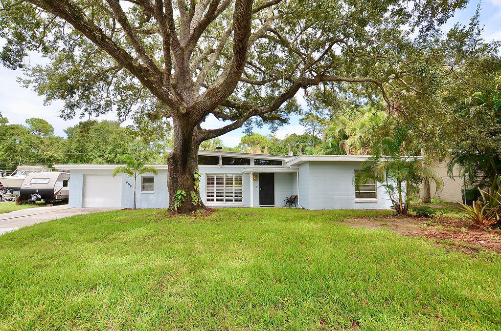 You will fall in LOVE! with this Charming Concrete Block Mid Century Modern home with 2017 Metal Roof, New A/C!. Move in ready. Brand new remodeled kitchen with quartz counters. Remodeled bathrooms.They don't make them like this anymore! Beautiful Wood beam ceilings, Brick Fireplace, Stunning Slate flooring in main areas and Luxury Vinyl Plank in bedrooms with built in closets. Garage is oversized with brand new washer and dryer and lots of storage space. There is a bonus room off the 3rd bedroom that could be used as a office, giant closet, Beautiful A/C'd Florida Room and Covered patio overlook your 11,326sf fenced yard. This is a quiet location that backs up to a preserve on the White City / River Park Border. Also listed for sale or could be rented 6 months for $2600 per month.