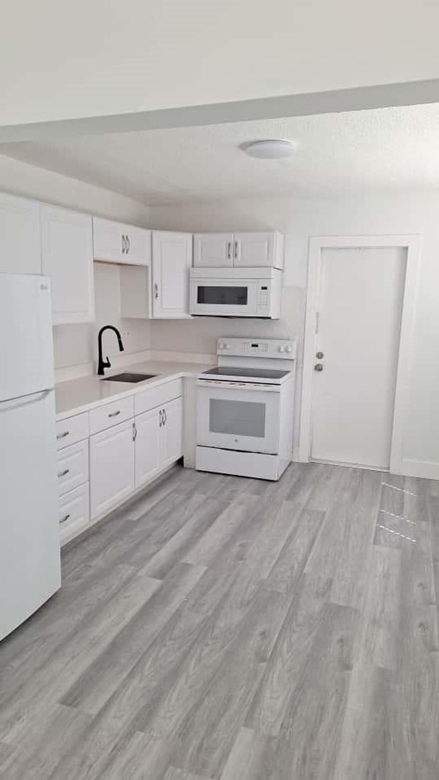 Amazing unit ready to move in. Everything is beautiful, with a huge driveway and patio, central A/C, washer and dryer, and private entrance. Oversized lot with mature landscaping provides ample space for outdoor enjoyment. Located just minutes from I-95, shopping, schools, and public transit. Owner will run the background check, no minimum credit required with strong proof of funds. Aditional $100 monthly flat fee for water.  The property is being painted outside and driveway in process of update. Come rent this unit, it won't last!