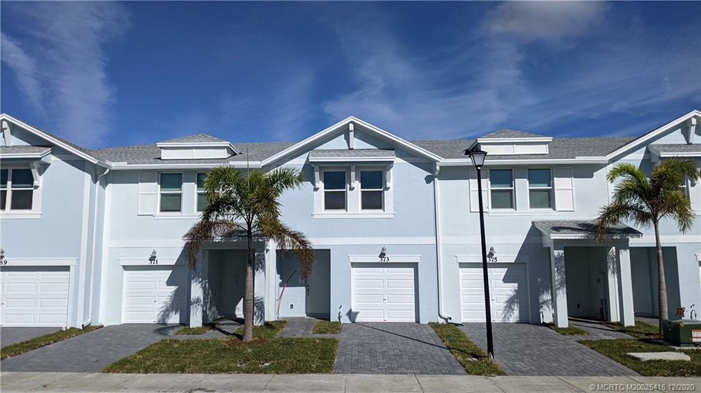 Excellent Lakefront Location, Great Value + Newer Energy Efficient Townhome in the Heart of Stuart! Welcome to the Community of ''Seaside''.This ''Pompano'' Model Floorplan Features 3 Bedrooms Upstairs complete with Washer/Dryer, 2.5 Bathrooms, a 1 Car Garage PLUS a Serene Lake View from the Rear Patio.True Concrete Block Construction PLUS Impact Windows & Doors Throughout! The Designer Inspired Interior Offers Stainless Steel Appliances, Granite Countertops plus 42'' White ''Chic'' Cabinetry. This ''Smart Connected'' Home Also Includes Advanced Thermostat, Smart Door Lock, Smart Garage Door+Interior USB Charging Ports. ''Seaside'' offers a Community Pool, Sidewalks & Lawn & Landscaping is Fully Included. Conveniently & Centrally Located ''PLUS'' right across the street from Poppleton Cree