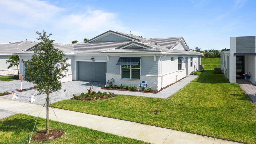 Photo of 11559 SW Viridian Boulevard, Port St Lucie, FL 34987 (MLS # R10891521)