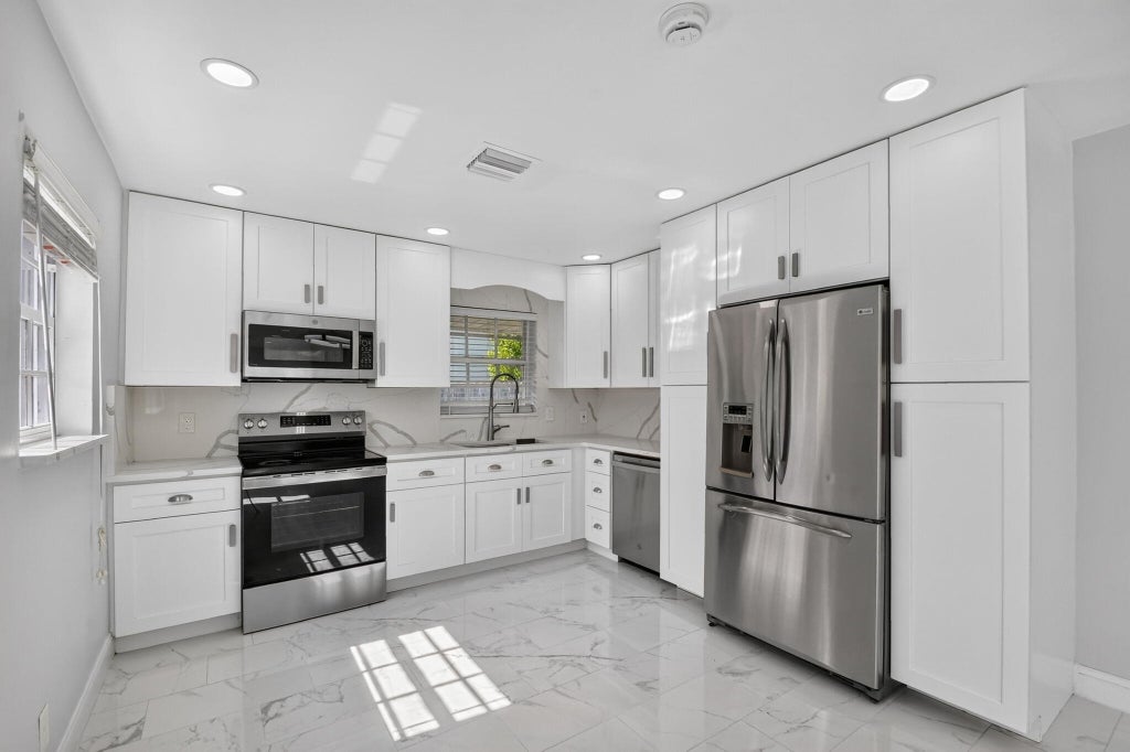 Photo of 423 Wilder Street, West Palm Beach, FL 33405 (MLS # B26094526)