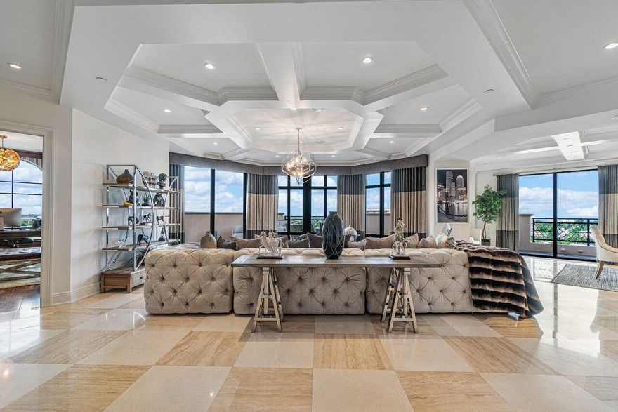 Completely remodeled contemporary penthouse. Every room features sprawling ocean and or downtown city views. This stunning 3 bedroom, 3.5 bath plus office and media room features exquisite marble and wood flooring detail throughout entire residence. 10 foot custom coffered ceilings, large beautiful gourmet kitchen with top of the line appliances, three large terraces with outdoor bar and expansive views. This penthouse boasts stunning finishes and absolutely breathtaking interior design. This penthouse also comes with it's own separate 4 car garage within the parking garage. Building also offers professional security, concierge, and valet services.