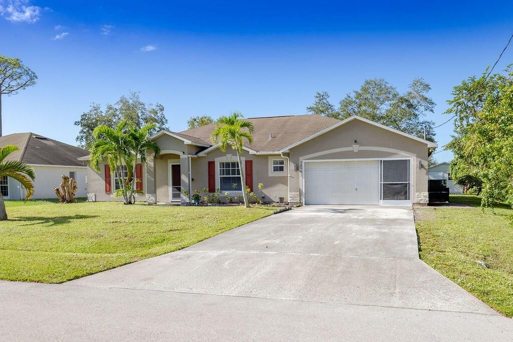 Photo of 3856 SW Cheribon Street, Port Saint Lucie, FL 34953 (MLS # R11037860)