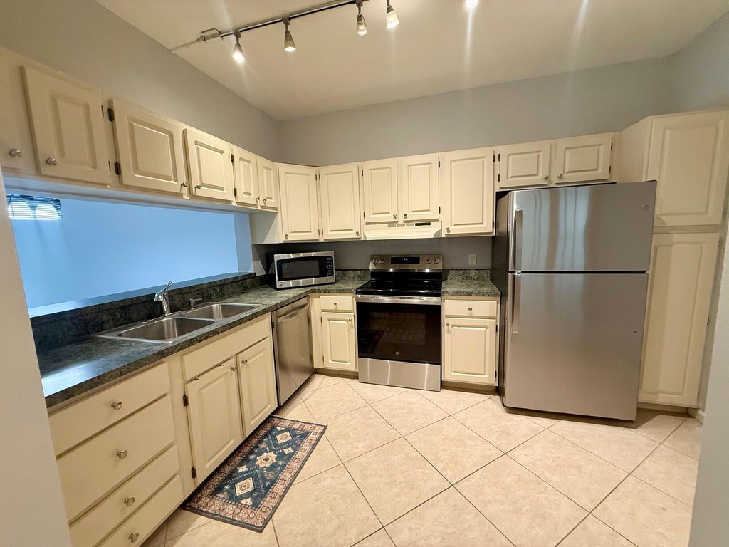 Photo of 101 Cypress Point Drive #101, Palm Beach Gardens, FL 33418 (MLS # B26024142)