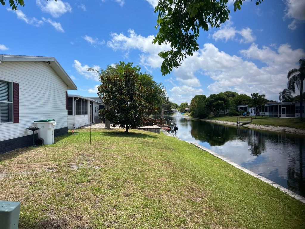 Photo of 6543 NW Nw 32nd Ave, Coconut Creek, FL 33073 (MLS # R10993909)