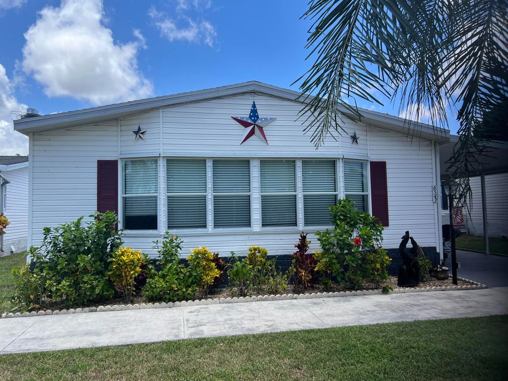 Photo of 6543 NW Nw 32nd Ave, Coconut Creek, FL 33073 (MLS # R10993909)