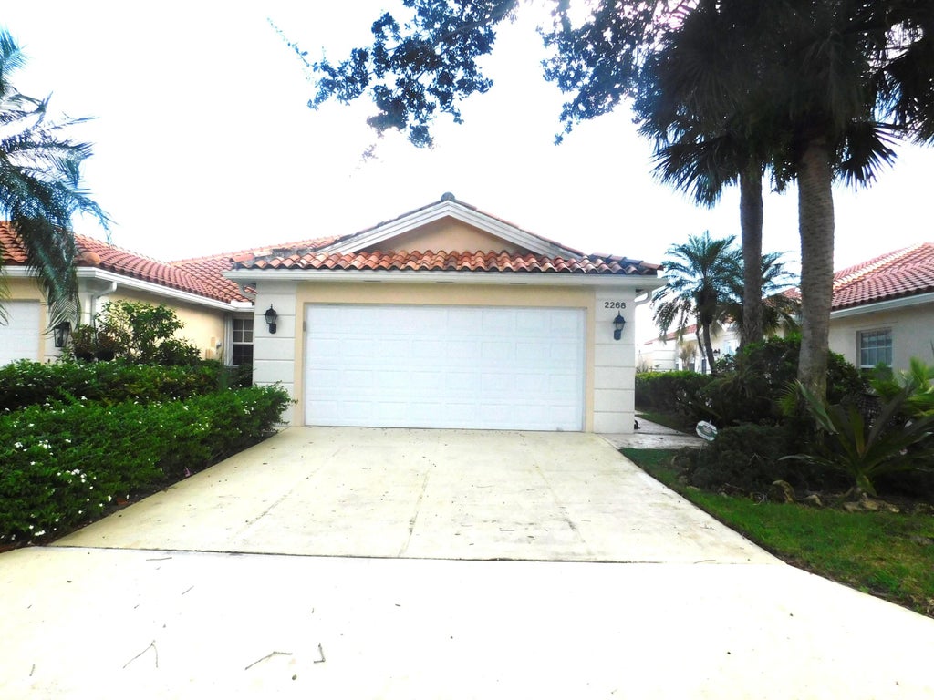 Photo of 2268 BLUE SPRINGS Road, West Palm Beach, FL 33411 (MLS # B26090117)