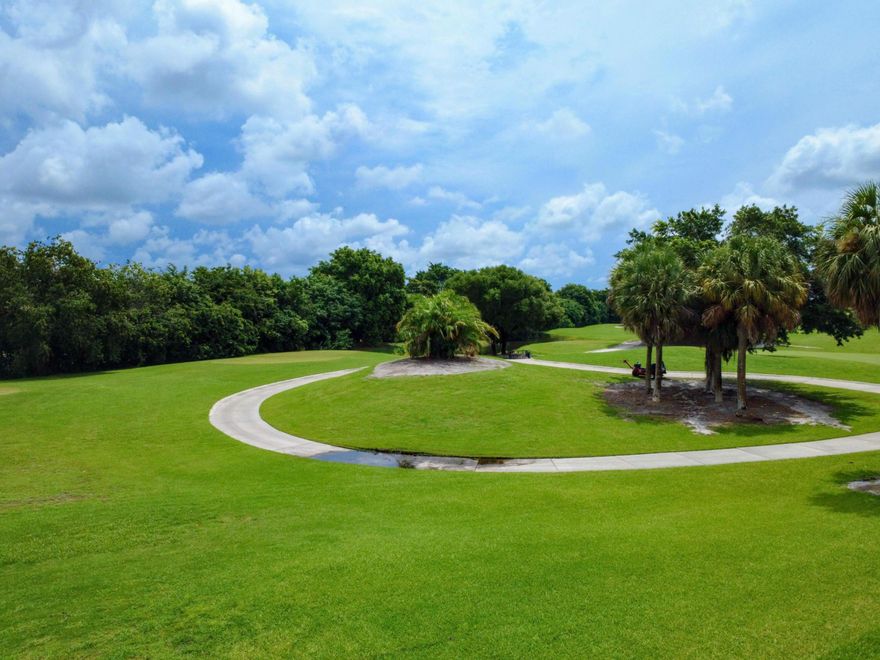 Beautiful 2 Bedroom 2 Full Bath second floor CORNER condo with a breathtaking  GOLF course view in the 55+ Gated community of Green Lakes in the prestigious Indian Spring Country Club located at 11090 Green Lake Drive 201 in Boynton Beach. Can be sold Furnished/Turnkey.  This home features an updated Kitchen with Granite Countertops, Wood Cabinets, Stainless Steel appliances, Luxury Vinyl Plank Flooring throughout - no carpet, Full-Size Washer/Dryer, and Remodeled Bathrooms with Granite and Stall Showers. The split-bedroom floor plan offers privacy when guests visit. The Screened Patio overlooks the Serene Golf Course. Accordion Shutters offer full Hurricane protection. Parking Space close to entrance. ROOF 2021. Golf Membership available BUT NOT mandatory that offers a clubhouse, pool,  tennis courts, and fitness center. Short drive to the Beach, Restaurants, trendy Atlantic Ave, and Houses of Worship.