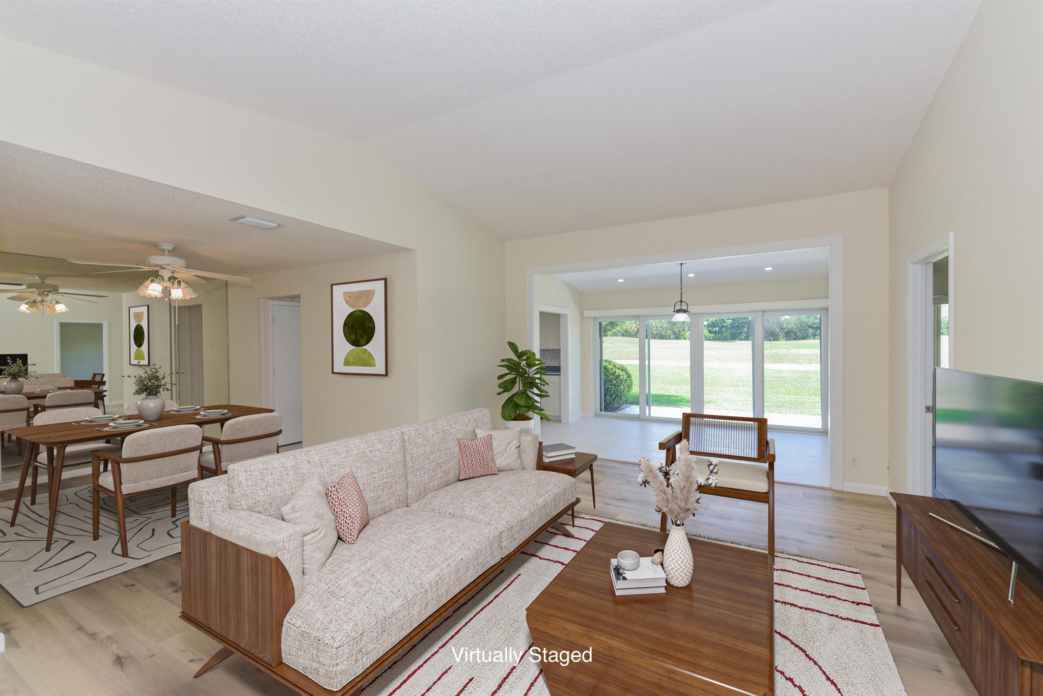 Impact windows and new vinyl flooring. Enjoy views of the Osprey Creek golf course from this move in ready villa. This gated community offers options for golf and social memberships, but not required. Experience peace of mind with PGT impact windows and slider and newer A/C (2019) and hot water heater (2024). The kitchen is spacious and bright. Home is vacant, photos with furniture are virtually staged.