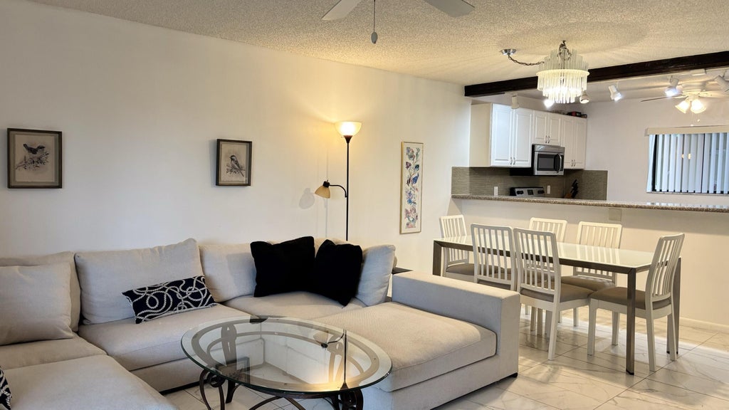 Photo of 5130 Las Verdes Circle #Apt 313, Delray Beach, FL 33484 (MLS # B26065466)
