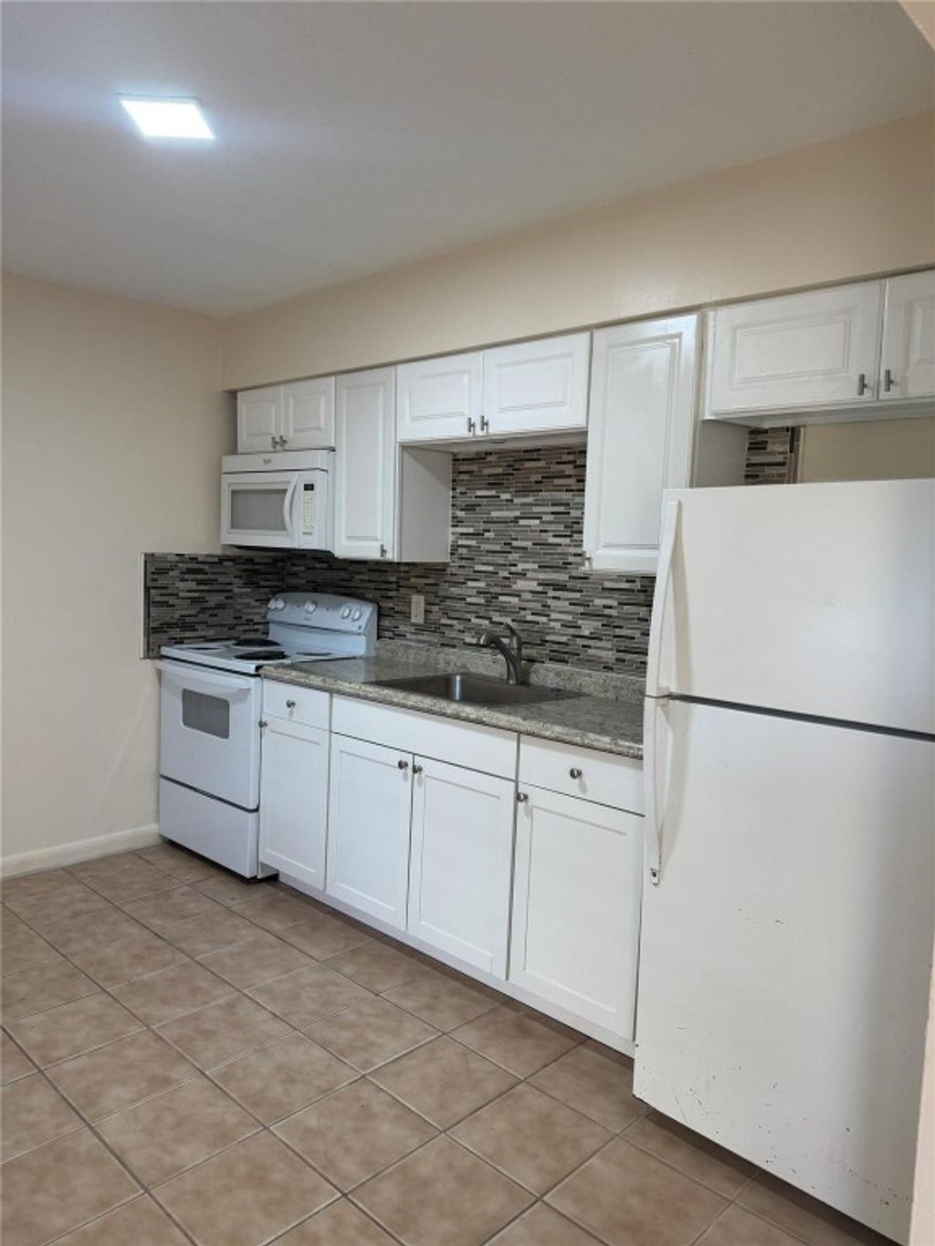 Photo of 3908 NW 30th Terrace #3, Lauderdale Lakes, FL 33309 (MLS # F10530842)