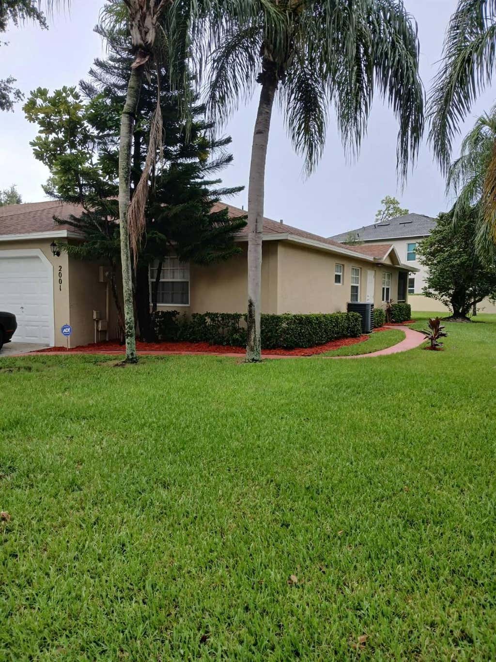Photo of 2001 Maplewood Drive, Greenacres, FL 33415 (MLS # R11014939)