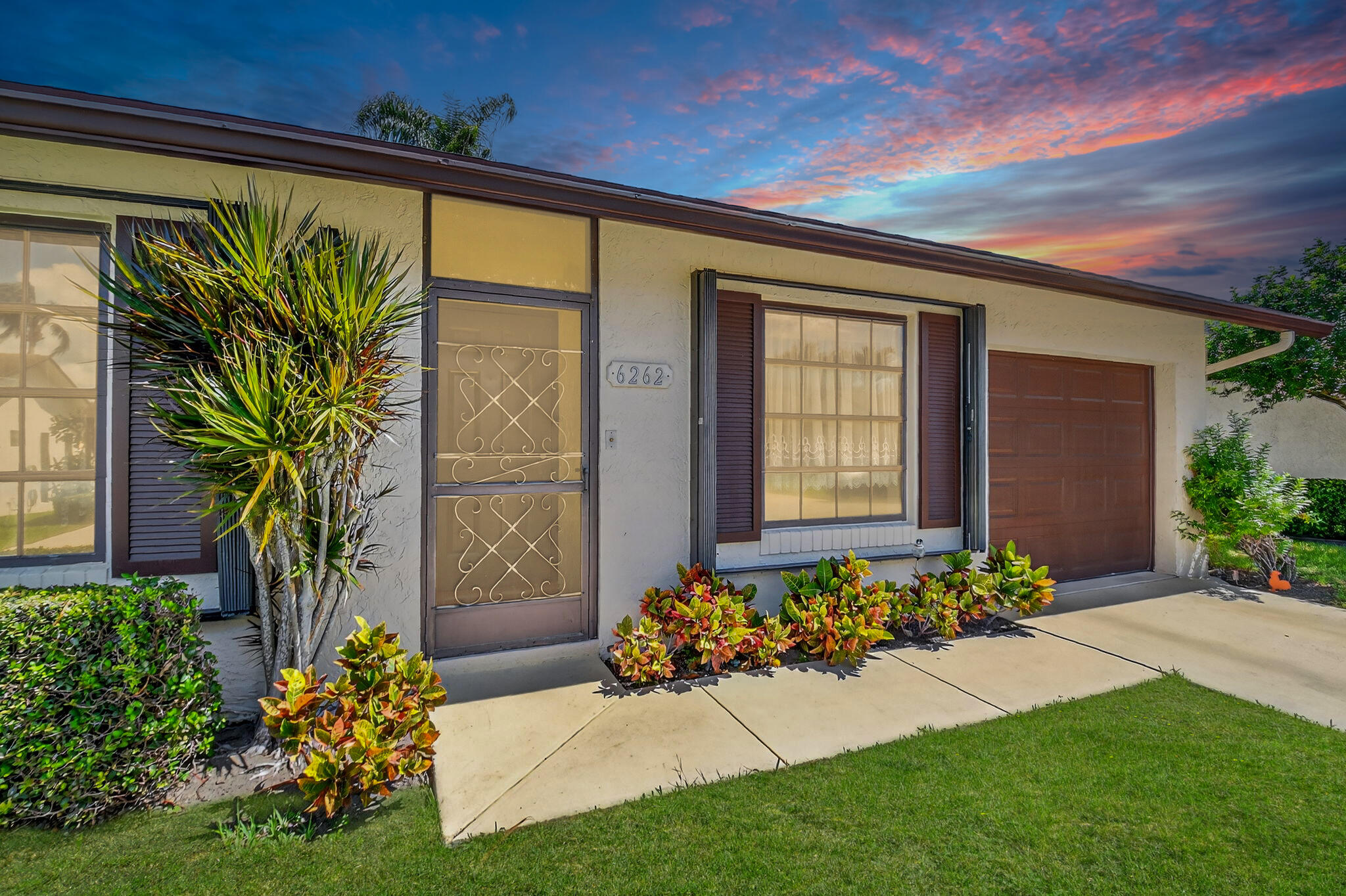 Lovely 2 Bedroom + Den Home in Desirable, 55+ Buttonwood West Community. Enjoy both a covered/screened patio and an open patio. Major system updates include a newer roof (2019), A/C (2016), and water heater (2014). Ceramic tile and wood laminate in the main living areas, with carpet in the bedrooms. Residents enjoy the peace of mind of a night guard at the community entrance, plus a manager on-site at the clubhouse. Amenities include a pool (with nighttime swimming allowed), fitness center, bocce, pickleball, tennis, shuffleboard, billiards, card room, jacuzzi, library, and more. Ideally located near shopping, dining, parks, beautiful beaches, the Turnpike, and Palm Beach International Airport.