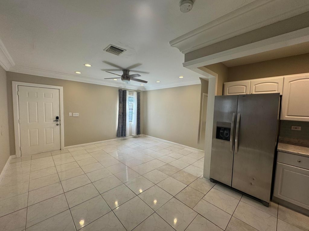 Photo of 839 NW 16th Terrace, Fort Lauderdale, FL 33311 (MLS # B26000461)