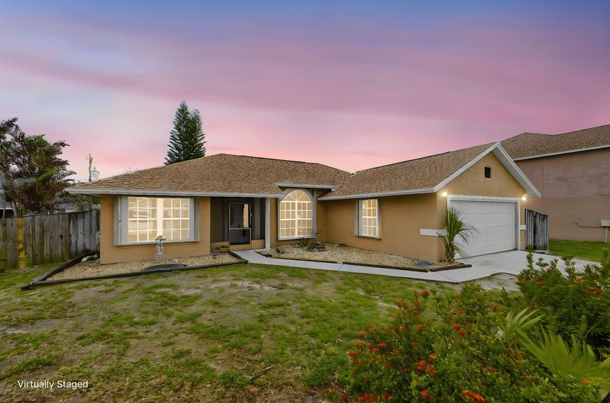 Welcome home to this immaculate 3 bedroom 2 bathroom, home with SCREENED POOL, located in highly sought after Port St. Lucie. NEW ROOF 2026! As soon as you enter, you immediately notice the soaring vaulted ceilings, abundant natural light and open floor plan. The home's kitchen has been beautifully updated with stainless steel appliances, modern shaker cabinets and granite countertops! There is both a living and family room that are great for entertaining! The home has new laminate flooring and has been freshly painted throughout! The primary bedroom features a walk in closet, and updated bathroom!  pool/garden view and large primary bath. The two secondary bedrooms are both of ample size with an updated adjacent bathroom. Out back, you walk into your own private, screened POOL, porch and patio! This is the perfect back yard for summer fun and relaxing! Excellent location just minutes to shopping, schools, dining, I95 and the Florida Turnpike!!! This home is super nice! Come see it today!!!!