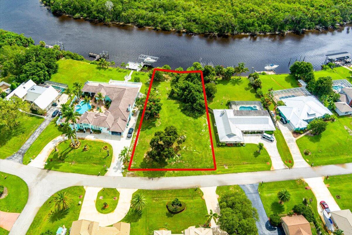 Embrace waterfront living with this rare .59-acre riverfront lot offering breathtaking views and direct access to the North Fork of the St. Lucie River. Located in a peaceful and private setting, this expansive property provides the perfect canvas for your custom-built dream home. With plenty of space for a pool, guest house, or expansive outdoor living area, the possibilities are endless. Enjoy boating, kayaking, or simply relaxing while watching the sunset from your own backyard. Whether you're looking for tranquility or the ideal spot for entertaining, this riverfront lot delivers the best of both worlds--natural beauty and convenient access to local amenities, beaches, and highways. Don't miss this exceptional opportunity to own a piece of paradise.
