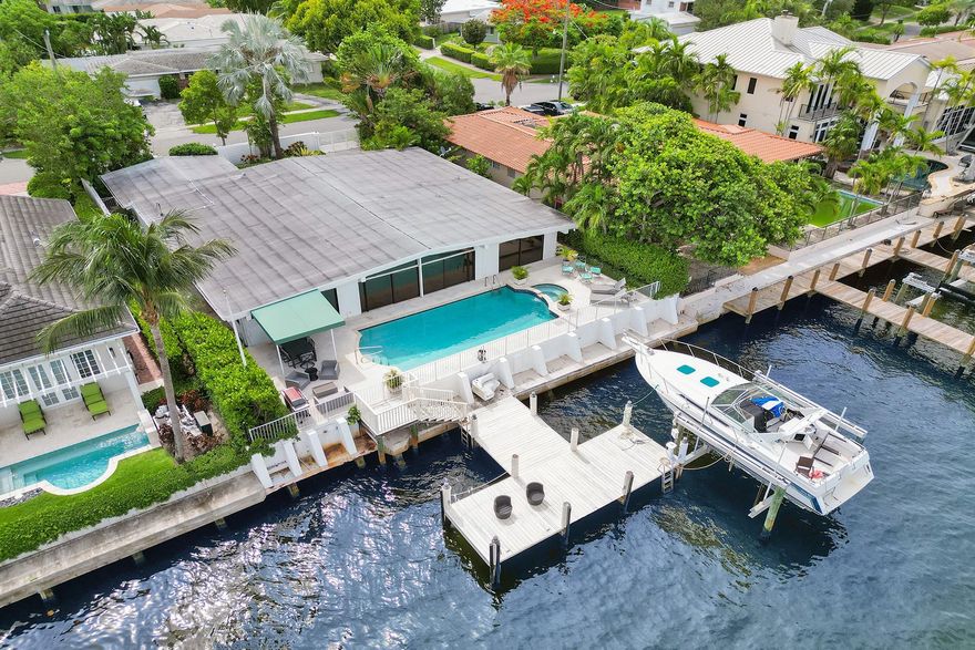 DIRECT OCEAN ACCESS!  4BD/3.5BR GATED POOL home in coveted Harbour Heights. Walk in & be greeted by breathtaking water views thru sliding doors that open to a pool, great deck & well-maintained dock—perfect for boating enthusiasts, mins to the ocean. This exceptional property features a tri-split layout ensuring privacy for guests, in-laws, or nanny &  primary suite w/ ABUNDANT closet space & SPACIOUS bathroom. Enjoy a BIG kitchen w/ eat-in dining area & an OVERSIZED living room. This home offers a blend of its EXCELLENT LOCATION AND OPPORTUNITY. Close to beaches, shopping, restaurants, airports, & highways. Priced VERY well for the area & previously used for successful short-term rentals, this property is a fantastic investment all around! Don’t miss the chance to make it your own!