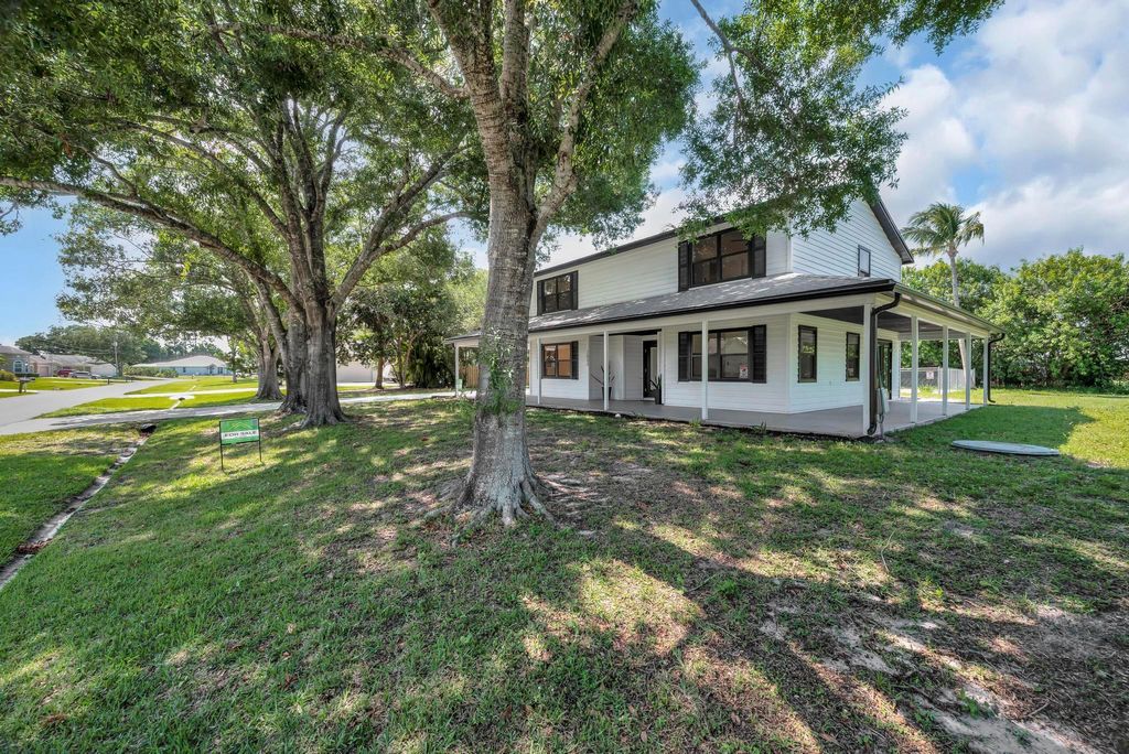 Photo of 2033 SW Justison Avenue, Port Saint Lucie, FL 34953 (MLS # R11093813)