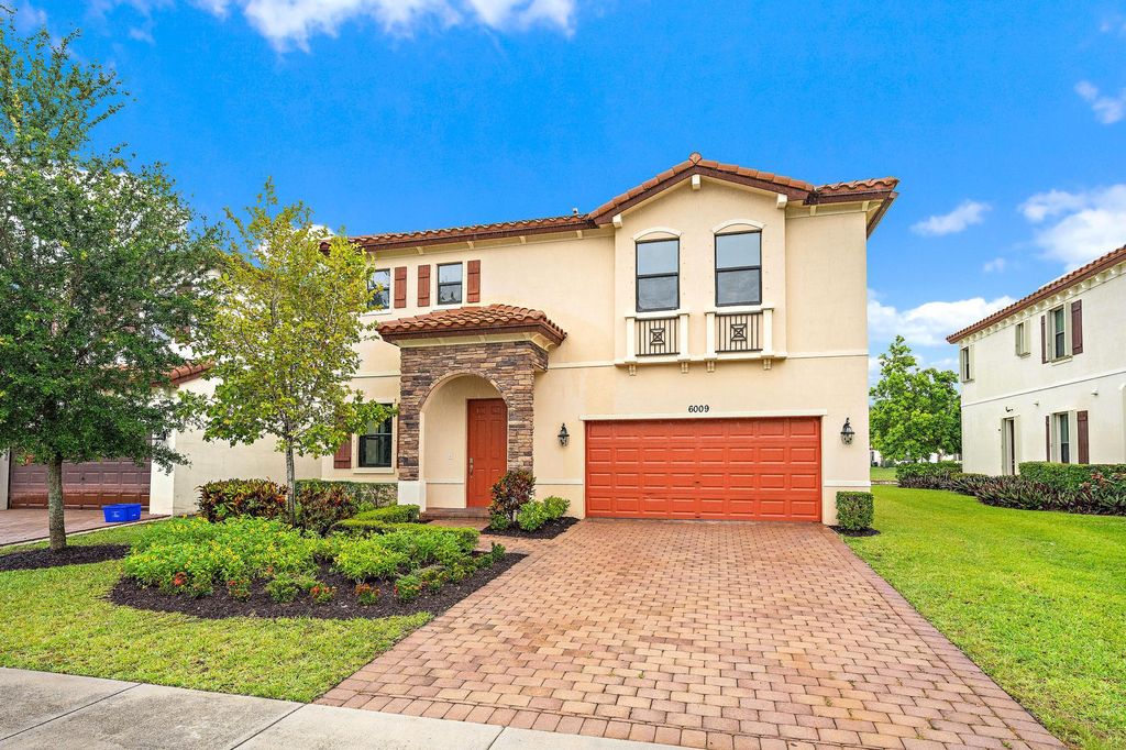 Photo of 6009 Night Heron Court, Greenacres, FL 33415 (MLS # B26017774)