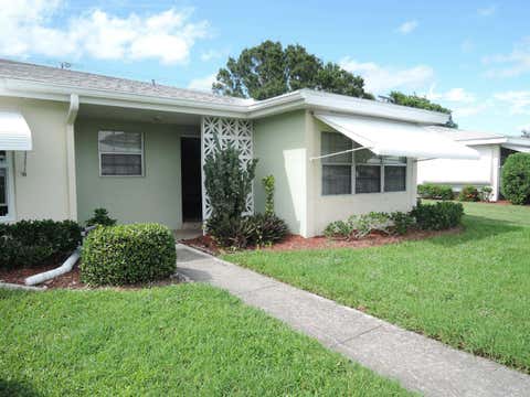 Photo of 115 Lakes End Drive #D, Fort Pierce, FL 34982 (MLS # B26025974)