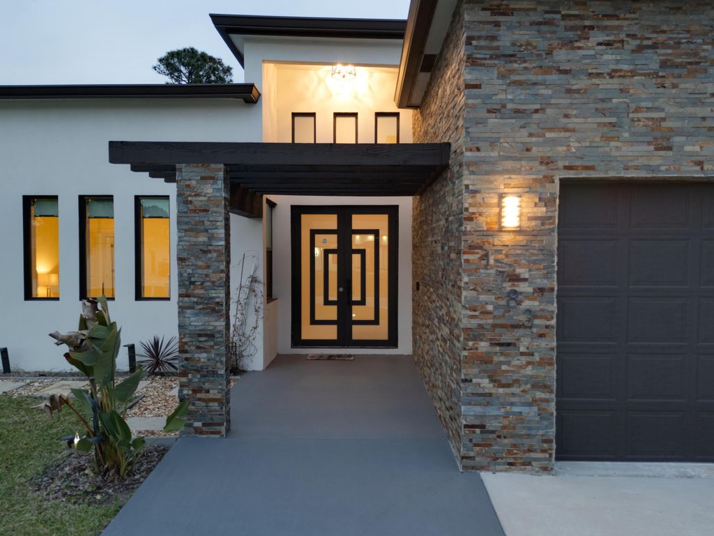 Photo of 1783 SW Erie Street, Port Saint Lucie, FL 34953 (MLS # B26008049)